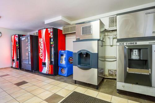 a row of soda machines in a convenience store at Motel 6 Mesa North in Mesa