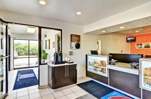 a lobby of a hotel with a food counter at Motel 6-Pittsburgh, PA - Crafton in Pittsburgh