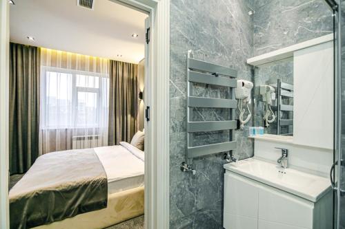 En eller flere senge i et værelse på GREEN PARK HOTEl