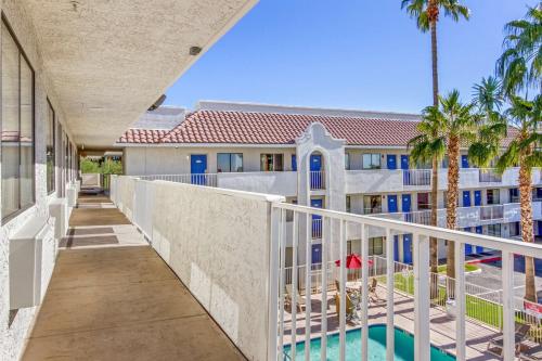 a balcony with a swimming pool and a building at Motel 6-Phoenix, AZ - West in Phoenix
