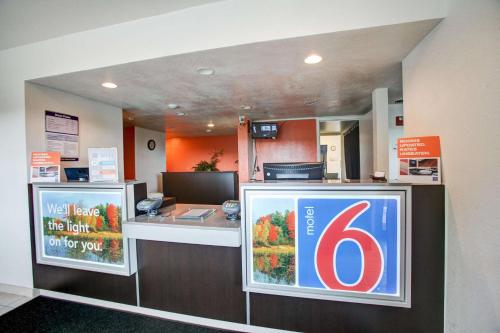 a store with a counter with a sign on it at Motel 6-Elkton, MD in Elkton
