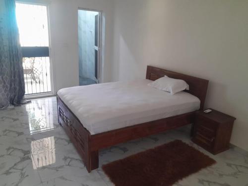 Giường trong phòng chung tại Port View Luxury Apartment Escacle Ziguinchor
