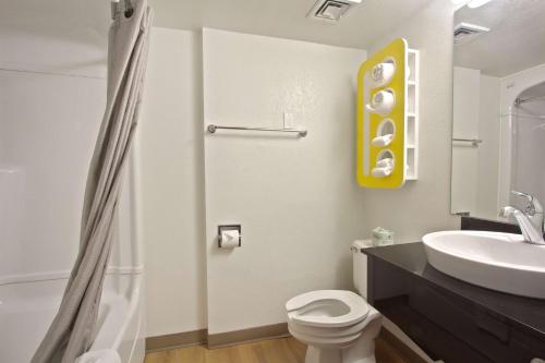 a bathroom with a white toilet and a sink at Motel 6-Piscataway, NJ in Piscataway
