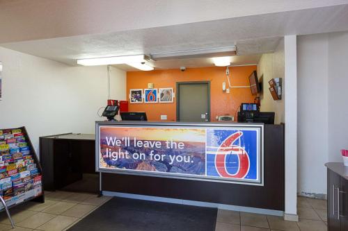a sign that says well leave the light on for you at Motel 6-Mesa, AZ - South in Mesa