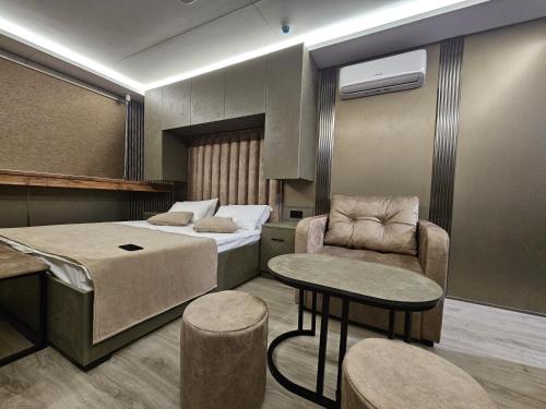 En eller flere senge i et værelse på Econest Aparan