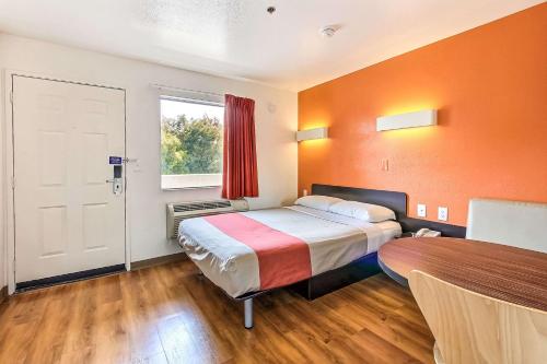 a hotel room with a bed and a window at Motel 6-Sunnyvale, CA - North in Sunnyvale