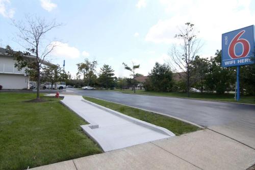 a street with a no parking sign next to a building at Motel 6-Middleburg Heights, OH - Cleveland in Middleburg Heights