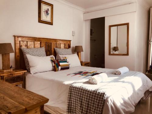 En eller flere senge i et værelse på MELJAA GROUP Guesthouse