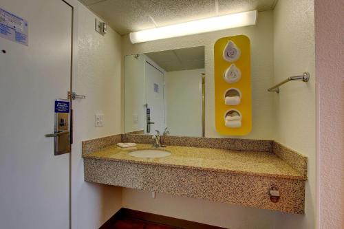 a bathroom with a sink and a mirror at Motel 6-York, PA - North in York