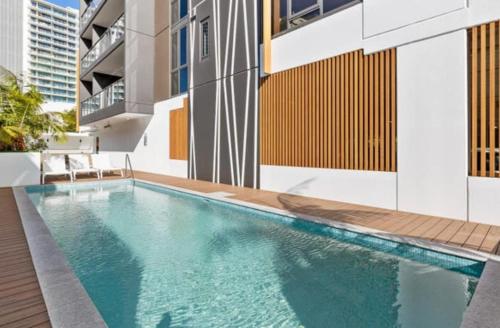 a swimming pool in the middle of a building at Surfers paradise Luxury 2BR River View Retreat in Gold Coast