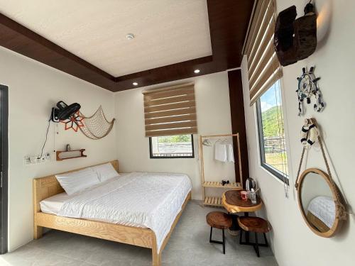 Postel nebo postele na pokoji v ubytování Làng Suối Homestay Vĩnh Hy