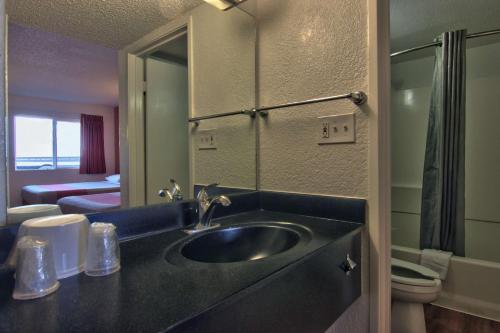 a bathroom with a sink and a mirror at Motel 6-Sacramento, CA - Old Sacramento North in Sacramento