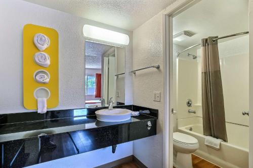 a bathroom with a sink and a toilet at Motel 6-Pleasanton, CA in Pleasanton