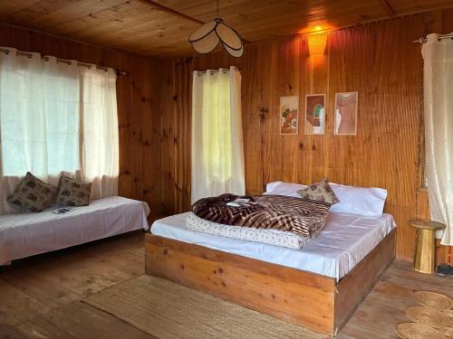 En eller flere senge i et værelse på Euphoria Shangarh - Hostel