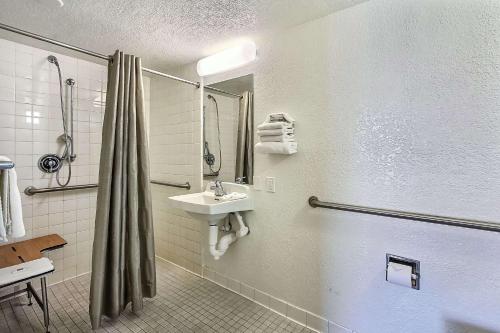 a bathroom with a sink and a shower at Motel 6-Campbell, CA - San Jose in Campbell