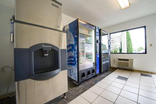 a room with a video game machine on a wall at Motel 6-Seattle, WA - Airport in SeaTac