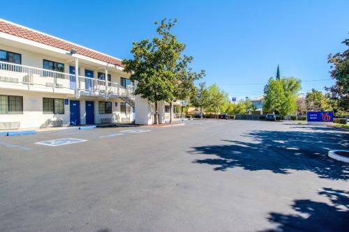 an empty parking lot in front of a building at Motel 6-Redding, CA - South in Redding