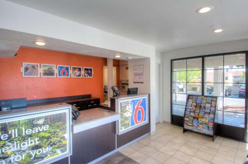 a fast food restaurant with an orange wall at Motel 6-Redding, CA - South in Redding