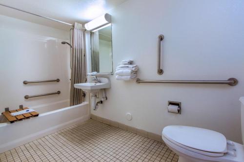 a bathroom with a toilet and a sink at Motel 6-Phoenix, AZ - Airport - 24th Street in Phoenix