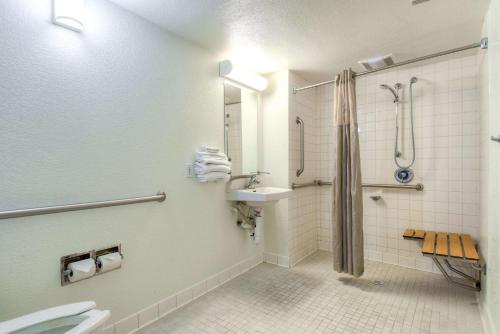 a bathroom with a shower and a sink and a toilet at Motel 6-Pomona, CA - Los Angeles in Pomona