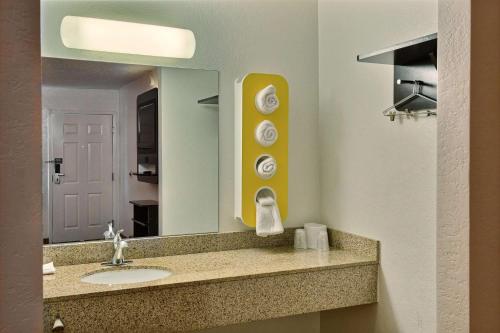a bathroom with a sink and a mirror at Motel 6-Tewksbury, MA - Boston in Tewksbury