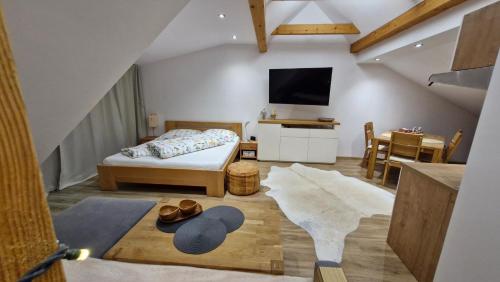 En eller flere senge i et værelse på Penzion PIANO