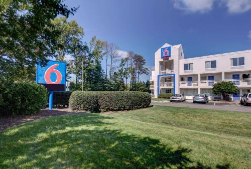 a sign in front of a building with a hospital at Motel 6 Virginia Beach in Virginia Beach