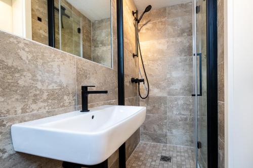 a bathroom with a sink and a shower at Haus Wittow in Breege
