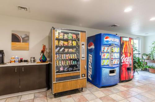 a soda machine and a pepsi refrigerator in a room at Motel 6-Bristol, VA in Bristol