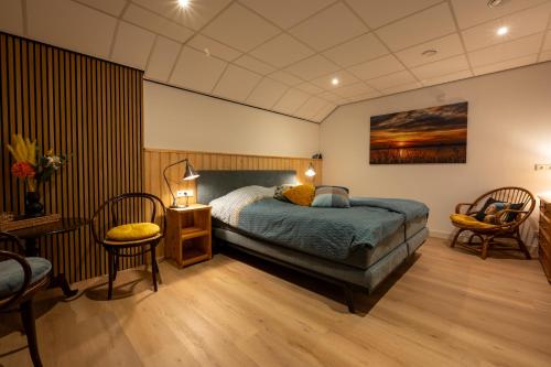 En eller flere senge i et værelse på B&B Stations Koffiehuis