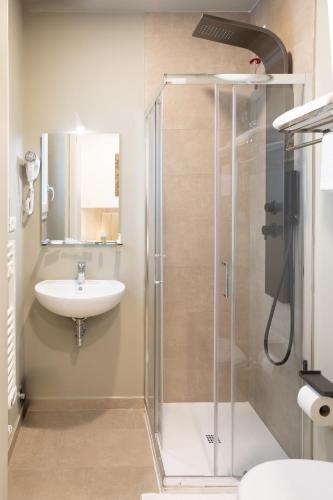 a bathroom with a shower and a sink at Hotel Richard in Agliana