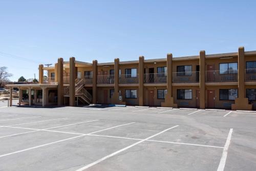 an empty parking lot in front of a building at Motel 6-Santa Fe, NM - Downtown in Santa Fe