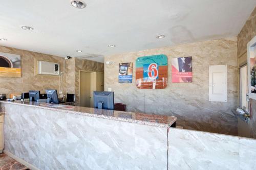a bar in a hotel lobby with a counter at Motel 6-Santa Fe, NM - Downtown in Santa Fe