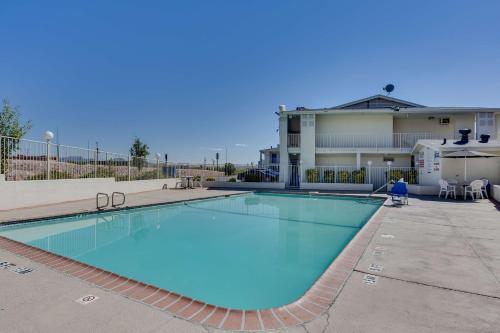a large swimming pool in front of a building at Motel 6-El Paso, TX - West in El Paso