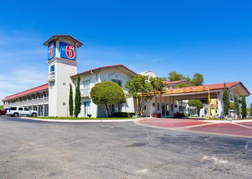 a building with a tower with a clock on it at Motel 6-Dallas, TX - Market Center in Dallas
