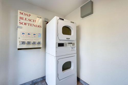 a machine in a room with a sign on the wall at Motel 6-Carson City, NV in Carson City
