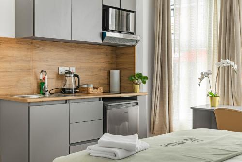 a kitchen with a sink and a counter top at Nottingham Forest The City Ground Studio Apartments in Nottingham
