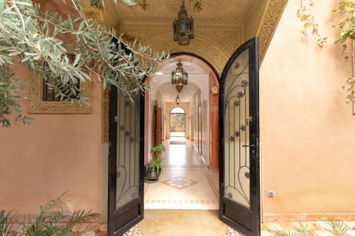 an entrance to a house with an open door at Villa Korima in Marrakesh