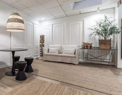 a living room with a couch and a table at Auditorio Rooms Boutique Oviedo in Oviedo