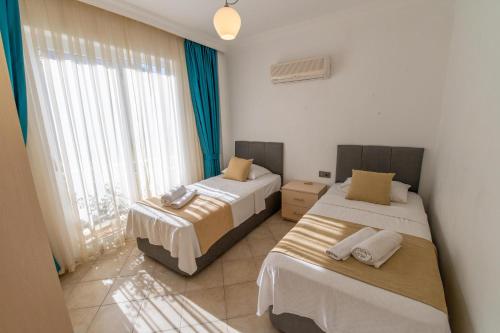 Postel nebo postele na pokoji v ubytování Sunset Beach Club Aqualettings Neptune 6