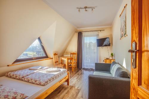 En eller flere senge i et værelse på Apartament II Chochołów 162c