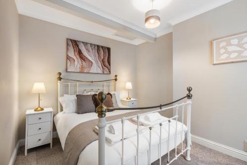 a bedroom with a bed with a white bed frame at Spacious - Central - King Beds - Fast Wi-Fi in Brighton & Hove