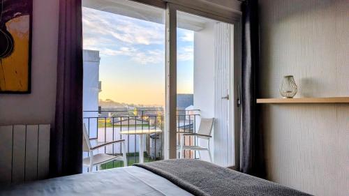 En eller flere senge i et værelse på Appartement de charme