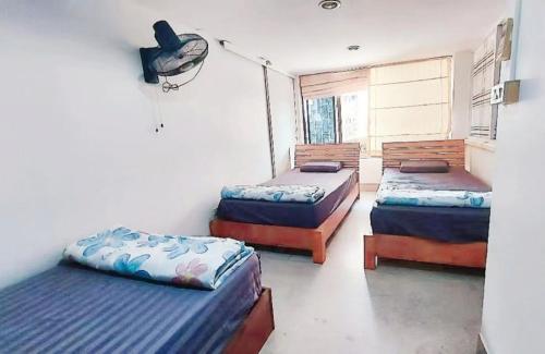 Postel nebo postele na pokoji v ubytování KingSun HOSTEL 金珊旅馆