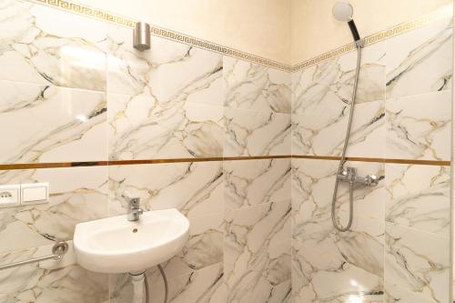 a bathroom with a sink and a shower at Villa Korima in Marrakesh