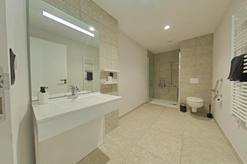 Et badeværelse på Appart hotel Saint-Denis