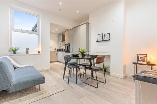 a kitchen and living room with a table and chairs at 3BR Sheffield Home - Contractor Friendly with WiFi in Sheffield