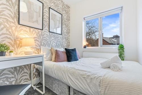 a bedroom with a bed and a window at 3BR Sheffield Home - Contractor Friendly with WiFi in Sheffield