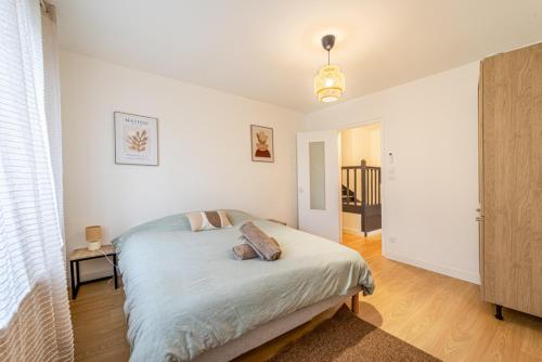 En eller flere senge i et værelse på L'Armonia en plein centre de Mordelles