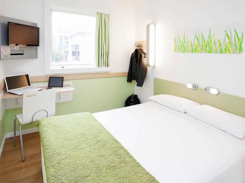 Postel nebo postele na pokoji v ubytování ibis budget Sao Paulo Paulista